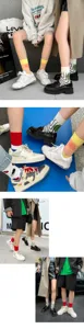 Trendy asymmetric color block cotton mid-tube socks for men and women, stylish street wear.