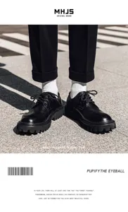 Detailed shot of men's leather shoes and white socks on street pavement background.