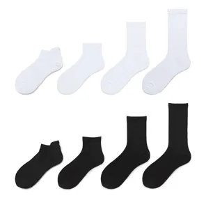 Men's solid color cotton socks set, black and white basic short and crew socks for daily wear.