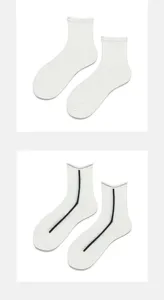 White Lolita JK mid-tube socks set, featuring ribbed ruffles and sheer stripe design.