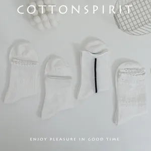 White Japanese Lolita mid-calf socks set, featuring cute ruffles and sheer mesh panels.