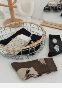 Detailed view of retro women's cotton socks featuring cute floral embroidery and plaid pattern.