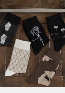 Detail shot of retro floral women socks showing fine knit texture and unique botanical designs.