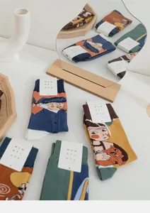 Artistic abstract face pattern cotton socks detail shot showcasing creative lifestyle design.