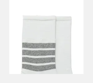 Women white mid-calf socks featuring iconic four-stripe design, stylish casual cotton socks.