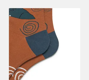 Abstract art pattern sock heel detail showing fine knit texture and unique brown and blue contrast.