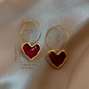 Eleganti orecchini a cerchio con cuore rosso da donna, gioielli alla moda dorati.