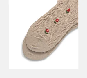 Beige knitted cable socks with delicate embroidered floral details, vintage style cotton socks.