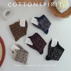 Vintage floral mid-calf socks for women, retro print cotton crew socks set flat lay.