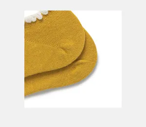 Cute women cotton short socks with white lace trim, solid mustard yellow detail style.
