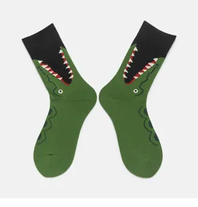 Detailed close-up of green cotton crew socks featuring a funny knit crocodile mouth.