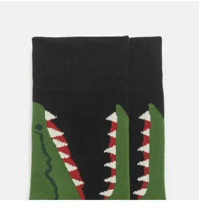 Detailed view of trendy cartoon alligator mouth knit mid-calf socks for men and women street style.