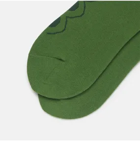 Green cotton socks detail shot showcasing premium knit texture, perfect for casual street fashion wear.