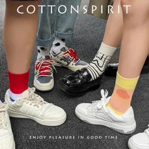 Trendy cotton mid-calf socks with irregular color blocks and polka dots for spring and autumn.