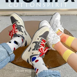 Stylish casual cotton socks with irregular color block dots for women and men, spring wear.