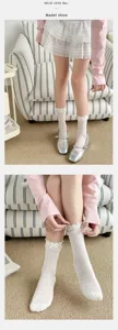 Detail view of women ballet style mid tube socks featuring cute bow and lace trim soft fabric.