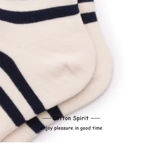 Close-up detail of striped cotton socks showing fine fabric texture and neat knitting craftsmanship.