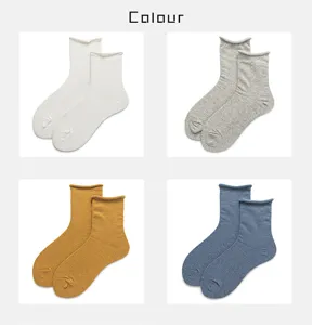 Women solid color ribbed mid tube socks with cute rolled hem detail close up view