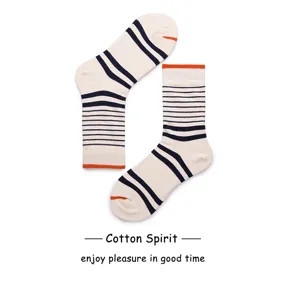 Close-up details of cream and navy striped cotton socks with orange trim for daily wear.