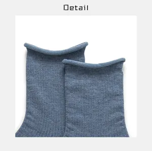 Blue cotton roll cuff sock detail closeup, ribbed texture, casual style display view.