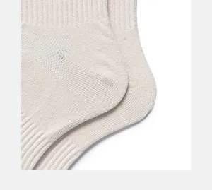 Beige ribbed cotton socks detail shot showcasing knit texture and reinforced heel.