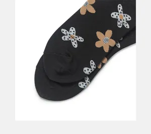Cute black floral women socks featuring sweet woven flower patterns for cozy autumn daily wear.