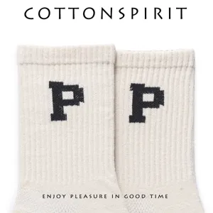 Korean style cotton mid tube socks with trendy pixel letter design for couples and daily wear.