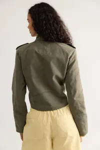 Detailed view of women's olive green cropped utility jacket with long sleeves and epaulets.