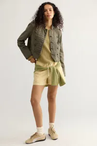 Women's vintage military style long sleeve cropped utility jacket with vintage metal buttons.