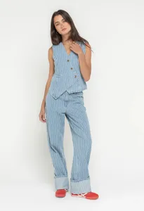 Detail shot of the stylish blue and white striped vest and trousers set, casual street style.