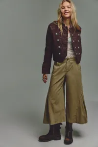 Detailed view of women casual long-sleeve military jacket with wide-leg pants outfit.