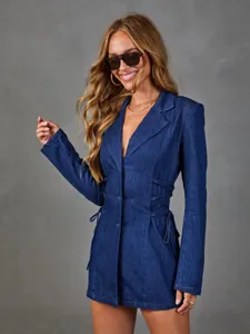 Close-up of women's dark blue denim blazer with lace-up waist design and lapel collar.