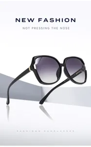 Detail de lunettes de soleil oversize a verres degrades, monture legere et pont confortable.