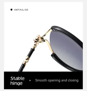 Women fashion sunglasses detail view with luxury pearl metal hinge and gradient lenses style.