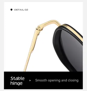 Gros plan detail de lunettes de soleil polarisees mecanisme de charniere metal dore stable.