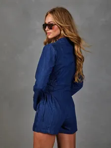 Detailed view of the stylish blue denim blazer romper featuring chic waist lace-up design.