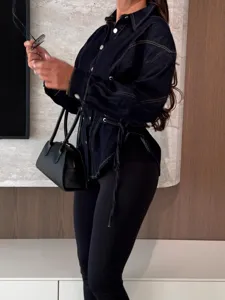 Women's stylish waist-cinched lace-up denim shirt, long sleeve lapel casual short top detail.
