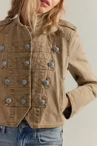 Close up detail of womens khaki military style cropped jacket with embossed metal buttons.