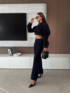 Dark blue denim crop jacket and high waist wide leg pants set with contrast stitching.