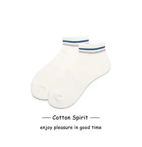 Close-up detail of white cotton ankle socks with blue grey stripes for daily sports wear.