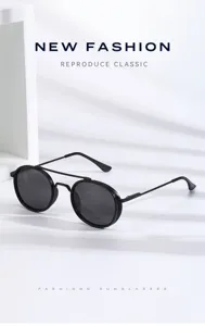 Close-up view of metal round sunglasses featuring double bridge and UV protection lenses.