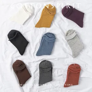 Women cotton mid-calf socks multi-color set flat lay showcasing cute rolled cuff design.