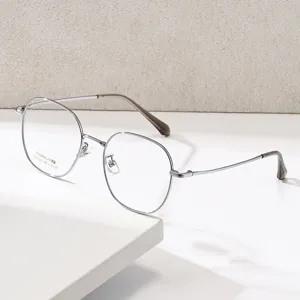 Montures de lunettes rondes en titane ultra-léger pour hommes et femmes, style minimaliste.