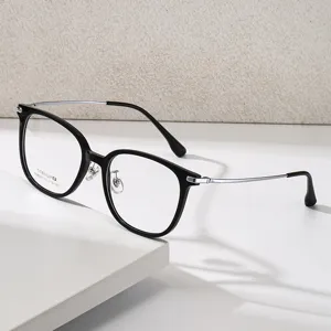Monture de lunettes ronde vintage avec cadre TR noir et branches en semi-titane femme.