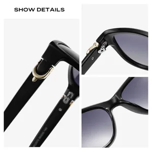 Lunettes de soleil de luxe pour femmes noires avec détail mors doré et verres dégradés chic.