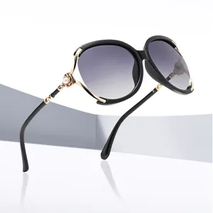 Oversized metal sunglasses for women, fashionable gradient lenses with elegant pearl decor.