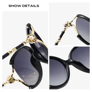 Oversized women's metal sunglasses with gradient lenses and elegant pearl floral decor.