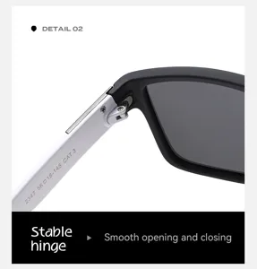 Détail de charnière de lunettes de soleil homme, monture bicolore à ouverture fluide.