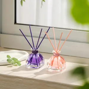 Aromatherapy essential oil diffuser set with glass bottles and reed sticks for home decor.