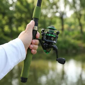 Fishing rod and spinning reel detail shot, green foam grip, portable outdoor fishing gear.